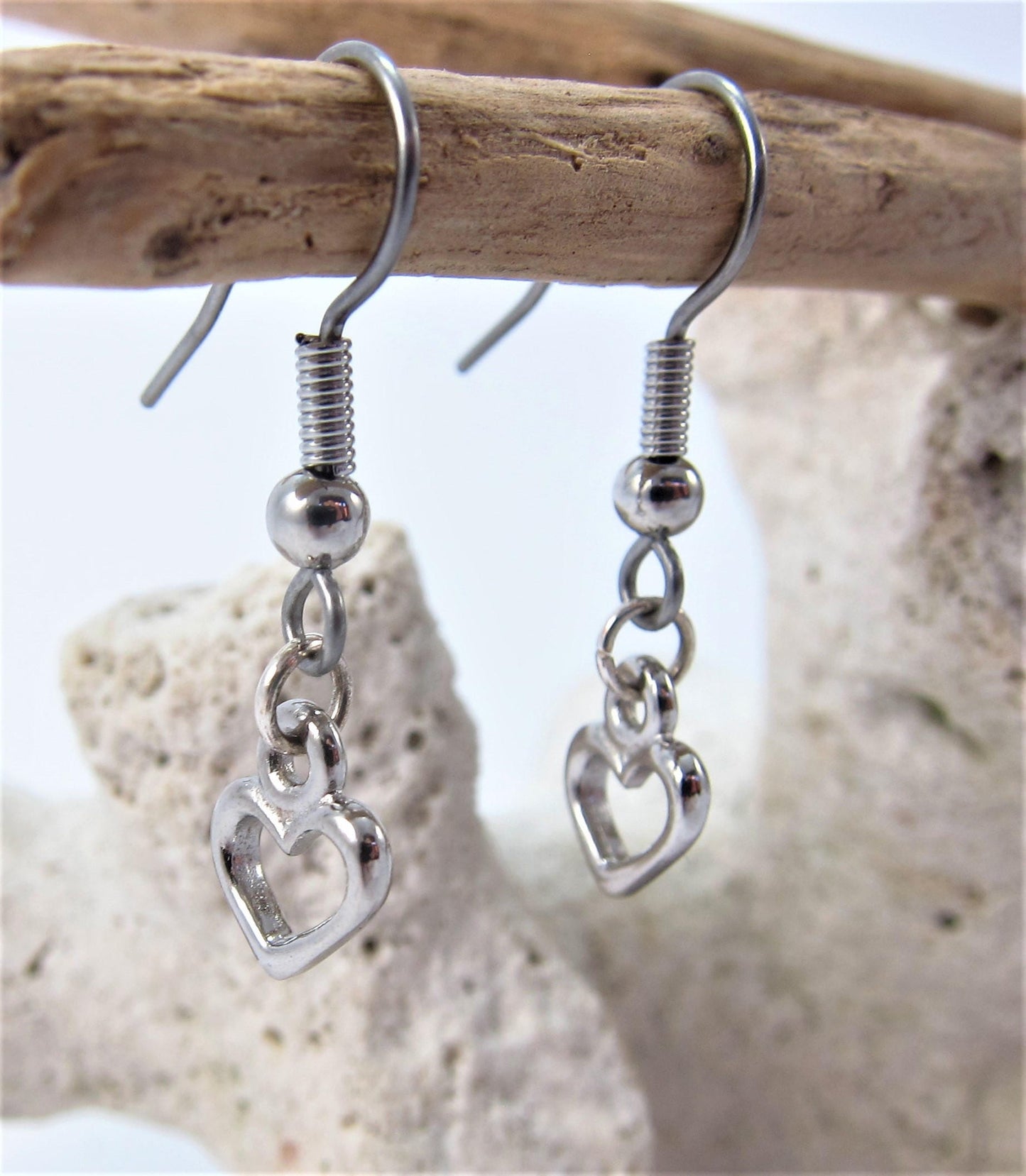 Charmed! Rhodium plate open heart earrings on hypoallergenic surgical steel hooks