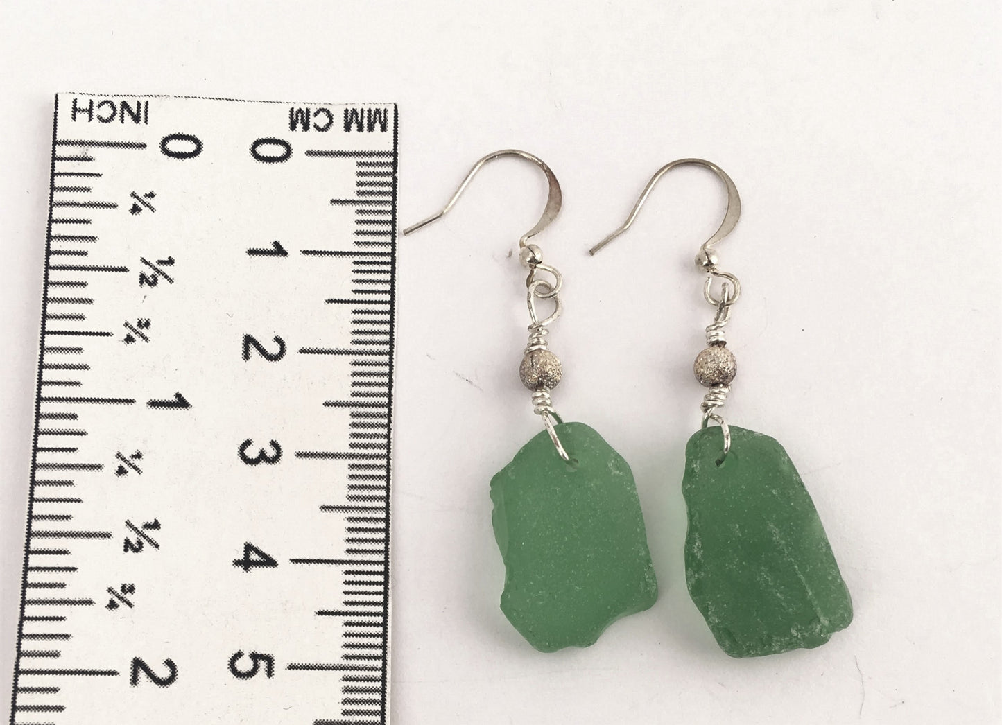 Stardust Earrings - Green sea glass from the South Shore, Nova Scotia, Canada with silver plated bead on a nickle-free hook