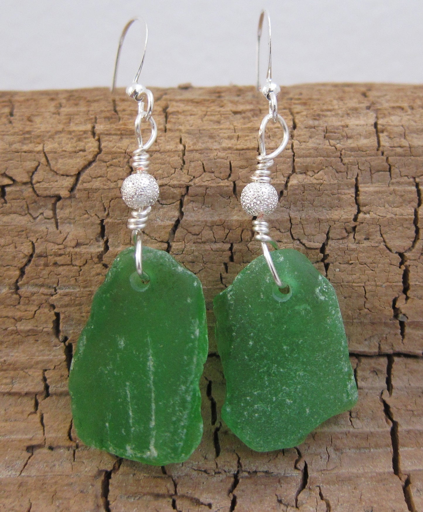 Stardust Earrings - Green sea glass from the South Shore, Nova Scotia, Canada with silver plated bead on a nickle-free hook