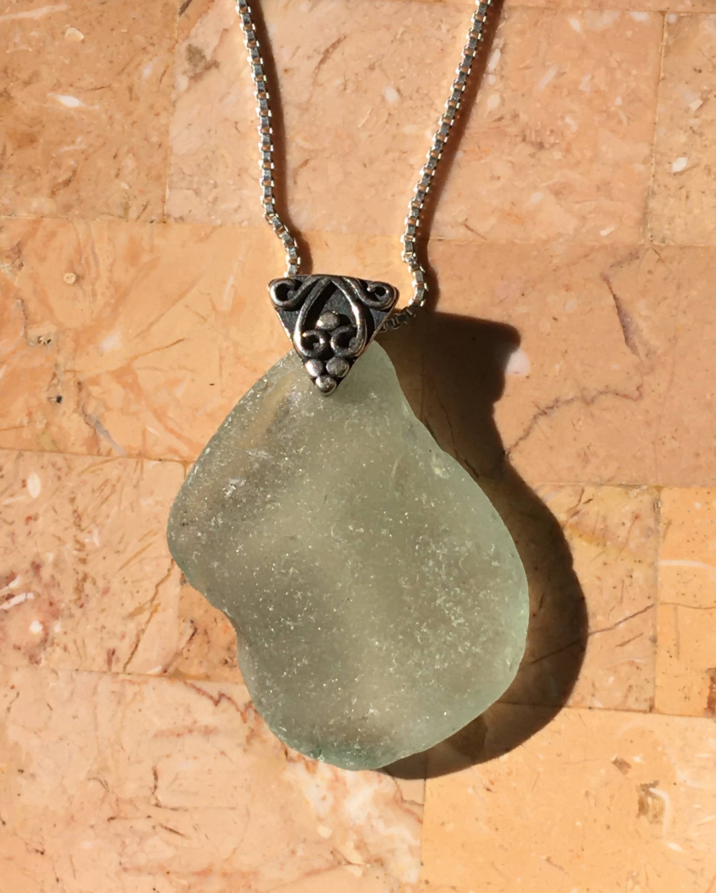 Shoreline Pendant - Aqua sea glass from Cape Breton, Nova Scotia, Canada with triangular Sterling silver bail with filigree motif in antique finish, on a boxchain