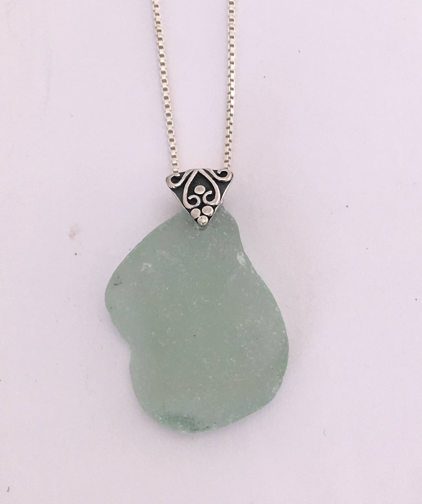 Shoreline Pendant - Aqua sea glass from Cape Breton, Nova Scotia, Canada with triangular Sterling silver bail with filigree motif in antique finish, on a boxchain