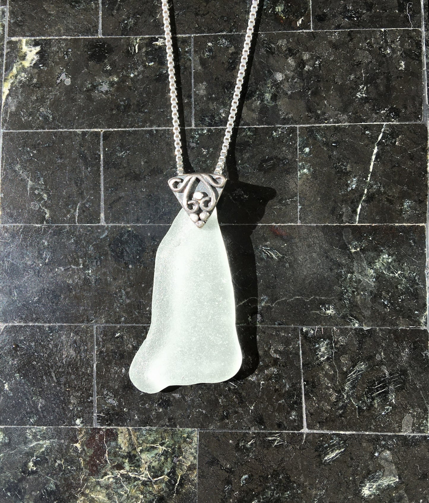 Shoreline Pendant - Pale aqua sea glass from Cape Breton, Nova Scotia, Canada with triangular Sterling silver bail with filigree motif in antique finish, on a boxchain