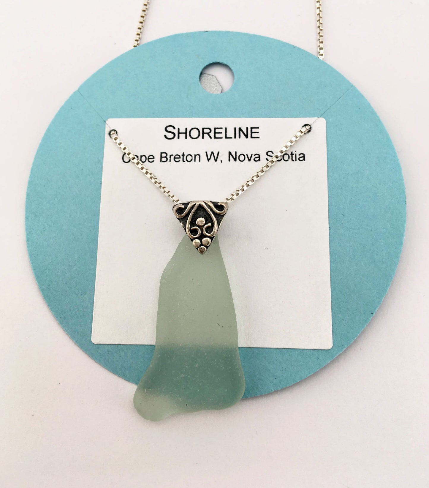 Shoreline Pendant - Pale aqua sea glass from Cape Breton, Nova Scotia, Canada with triangular Sterling silver bail with filigree motif in antique finish, on a boxchain