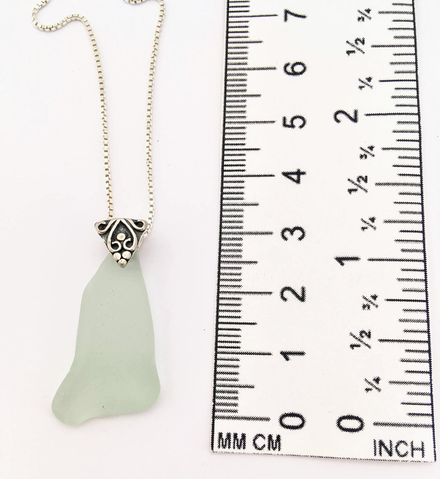 Shoreline Pendant - Pale aqua sea glass from Cape Breton, Nova Scotia, Canada with triangular Sterling silver bail with filigree motif in antique finish, on a boxchain