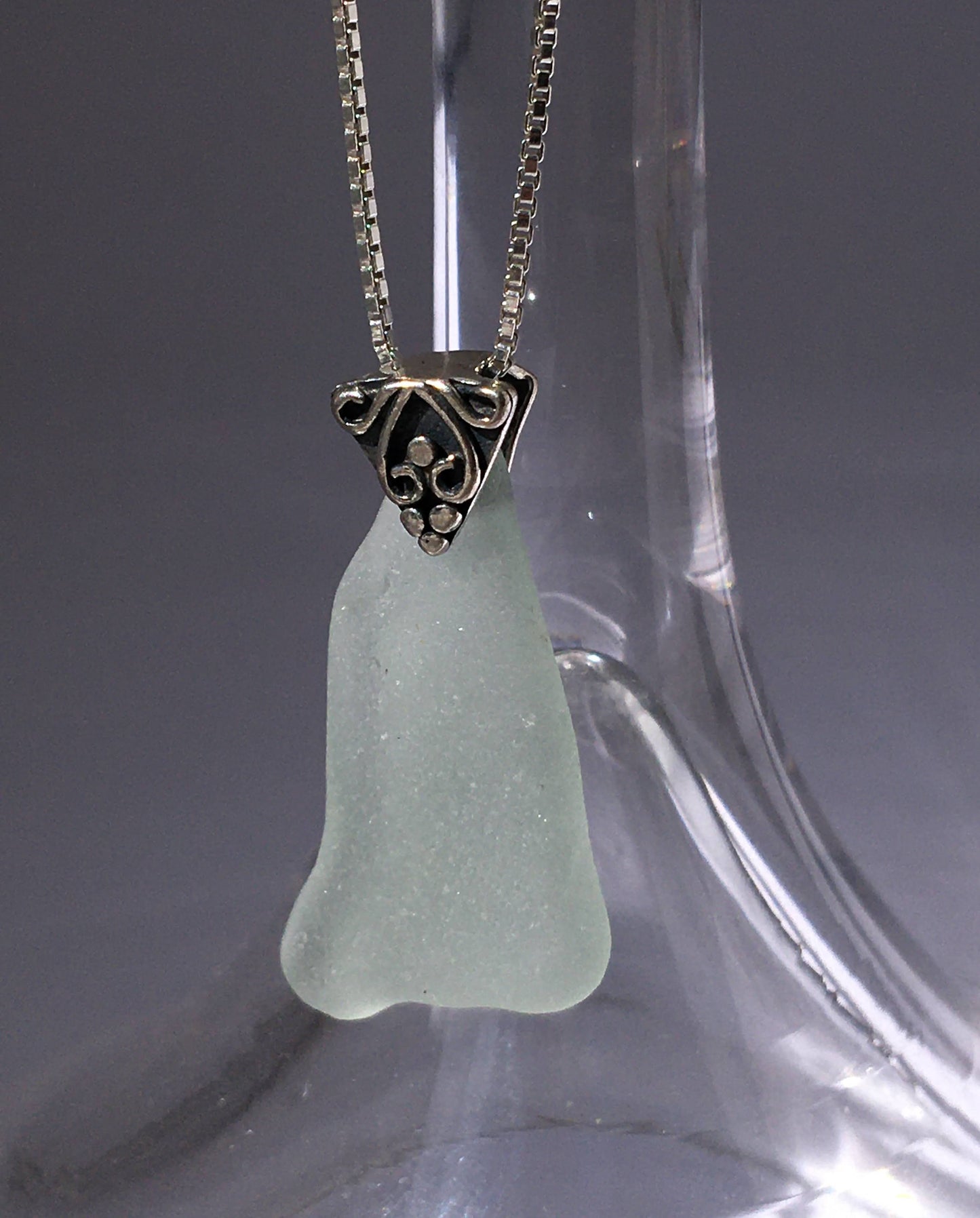 Shoreline Pendant - Pale aqua sea glass from Cape Breton, Nova Scotia, Canada with triangular Sterling silver bail with filigree motif in antique finish, on a boxchain