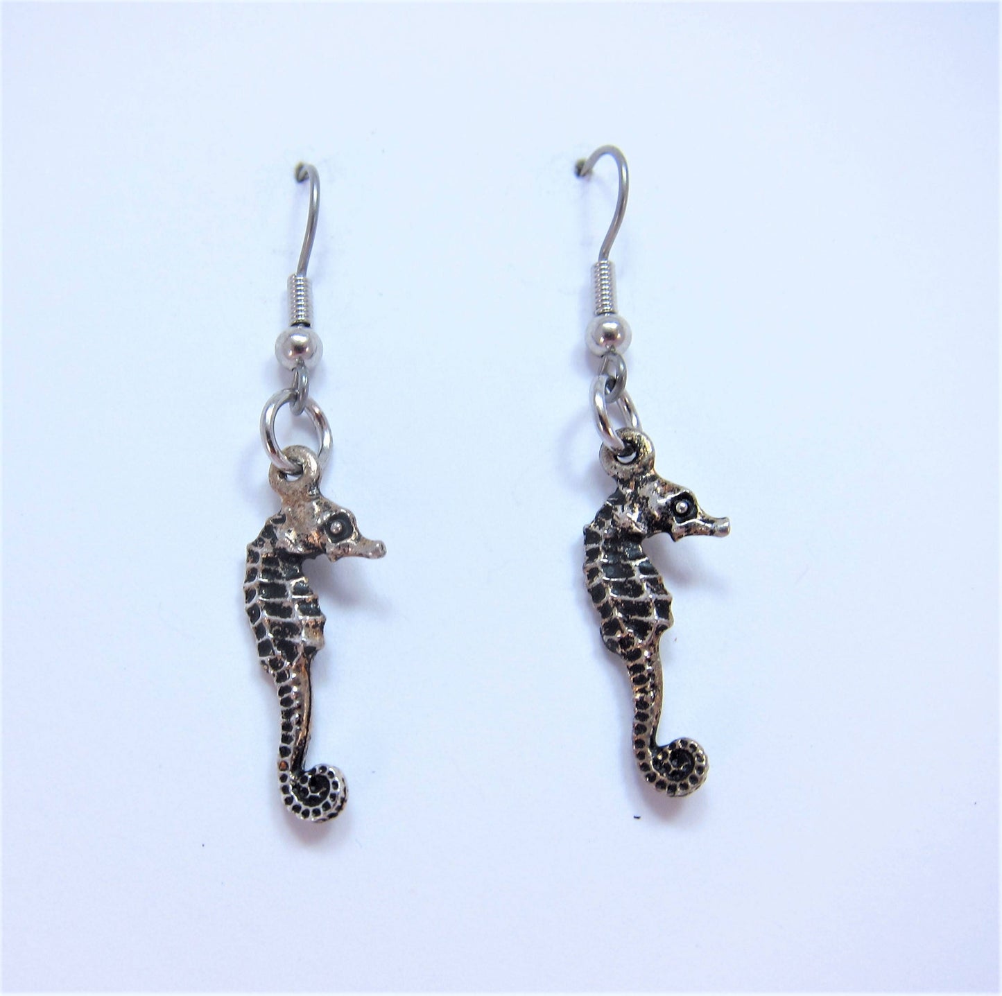 Charmed! Sea horse earrings silver plate antique finish on hypoallergenic surgical steel hooks