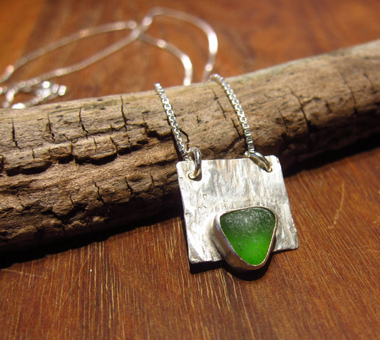 Green sea glass from Sydney, Cape Breton, Nova Scotia, Canada bezel set on Sterling silver textured base with 18" 925 Sterlingbox chain
