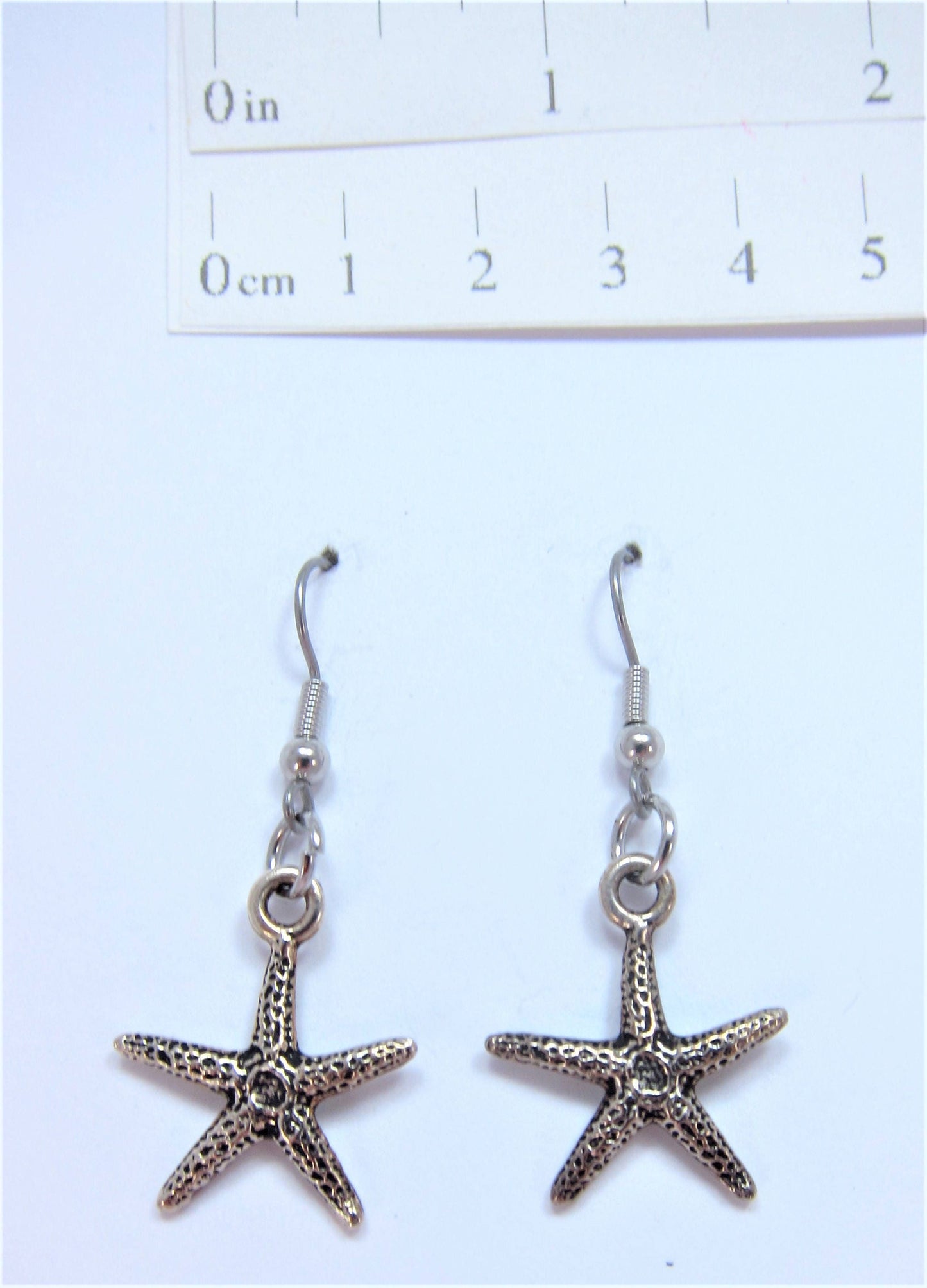 Charmed! Starfish / Sea star earrings silver plate antique finish on hypoallergenic surgical steel hooks