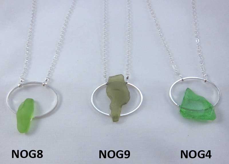 Necklace with green Nova Scotia sea glass mounted on silverplate oval with silverplate chain